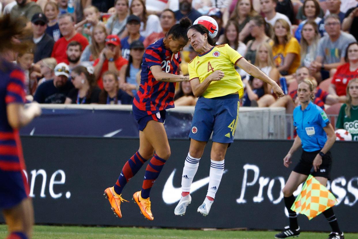 USA forward Carson Pickett (26) and Columbia midfielder Diana Ospina (4) battle in the first half.