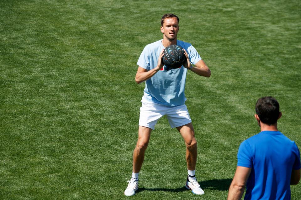 Daniil Medvedev works out on the lawn at the Indian Wells Tennis Garden during the BNP Paribas Open in Indian Wells, Calif., on March 10, 2022.  