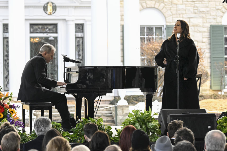 Alanis Morissette, right, and Mike Farrell perform during a memorial service for Lisa Marie Presley Sunday, Jan. 22, 2023, in Memphis, Tenn. She died Jan. 12 after being hospitalized for a medical emergency and was buried on the property next to her son Benjamin Keough, and near her father Elvis Presley and his two parents. (AP Photo/John Amis)