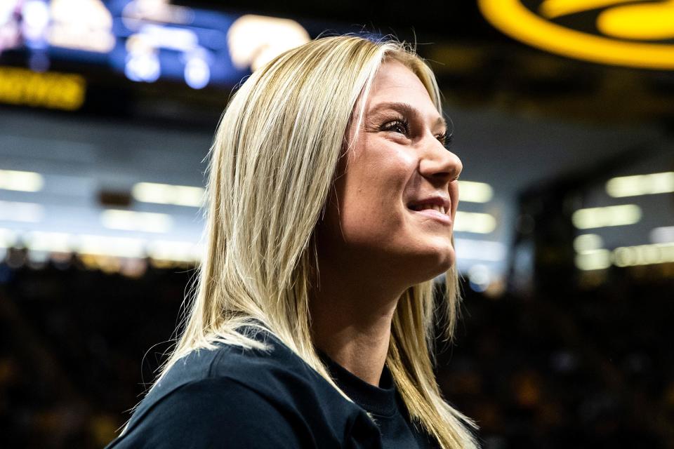 Felicity Taylor looks up into the crowd during an NCAA men's wrestling dual between Iowa and California Baptist on Nov. 13 at Carver-Hawkeye Arena in Iowa City.