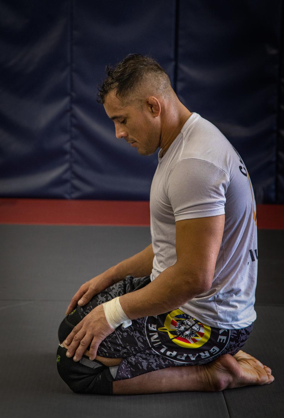 Alabama National Guard Pfc. Elioenai Campos stretches and practices breathing exercises before a jiu-jitsu training session in Columbiana, Alabama, June 10, 2022. Campos is part of the United States national jiu-jitsu team set to compete for international honors at the World Games in Birmingham.