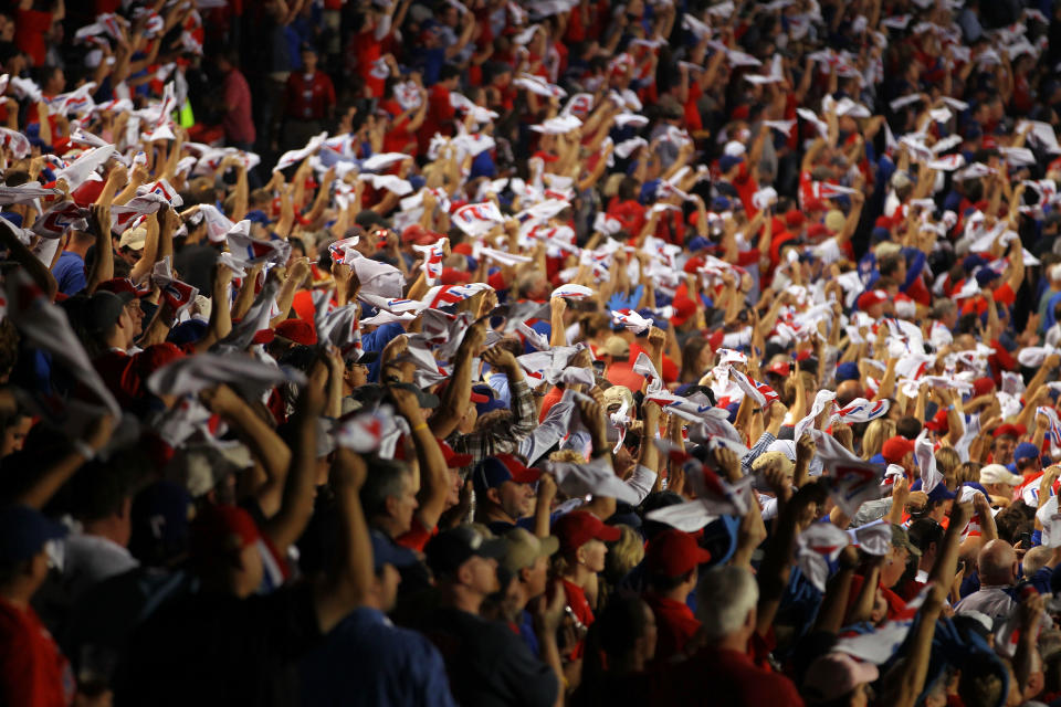 ARLINGTON, TX - OCTOBER 24: Fans wave rally towels during Game Five of the MLB World Series between the St. Louis Cardinals and the Texas Rangers at Rangers Ballpark in Arlington on October 24, 2011 in Arlington, Texas. (Photo by Ezra Shaw/Getty Images)