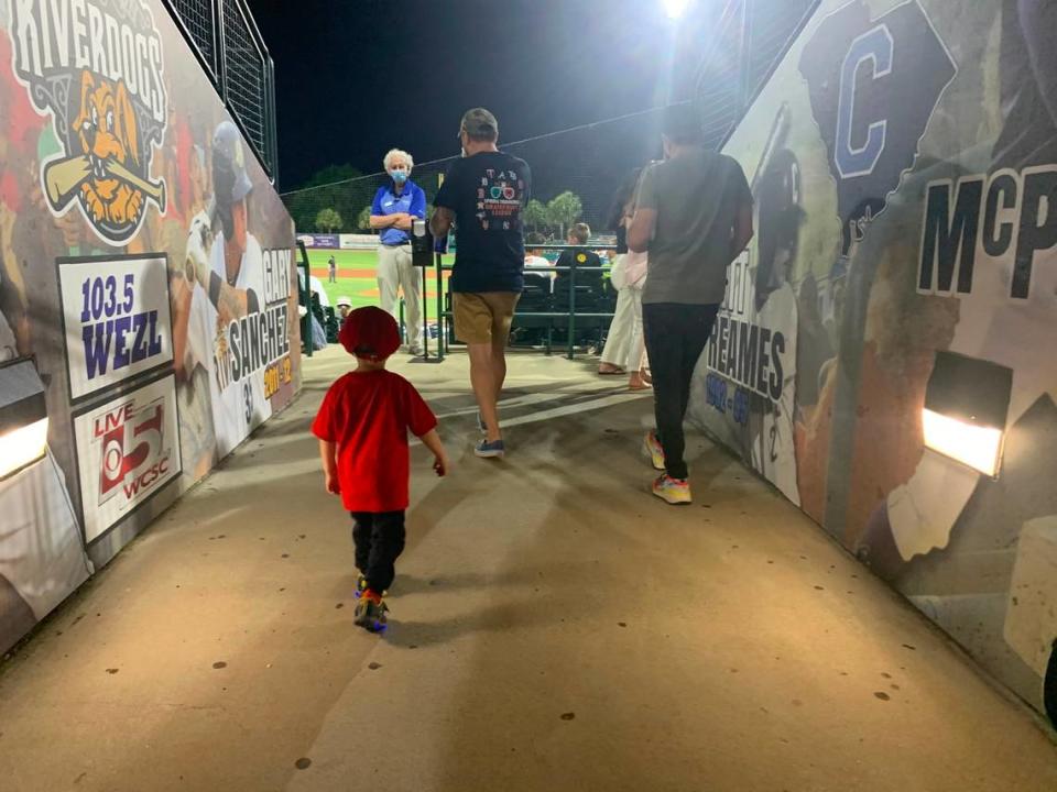 Fans walk back to their seats for the Charleston RiverDogs season-opener on May 4, 2021. The RiverDogs beat the Myrtle Beach Pelicans 6-3.