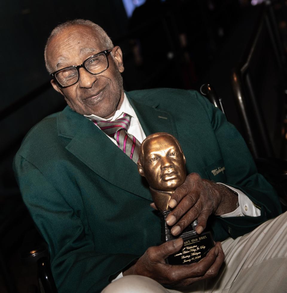 Former Michigan State University track and field coach James Bibbs holds the King Legacy of Service Award he was honored with Monday, Jan. 15, 2024, during the 39th annual Martin Luther King Jr. Day of Celebration at the Lansing Center in downtown. Bibbs was the first Black head coach at Michigan State University, and the first Black head track coach in the Big 10 conference.