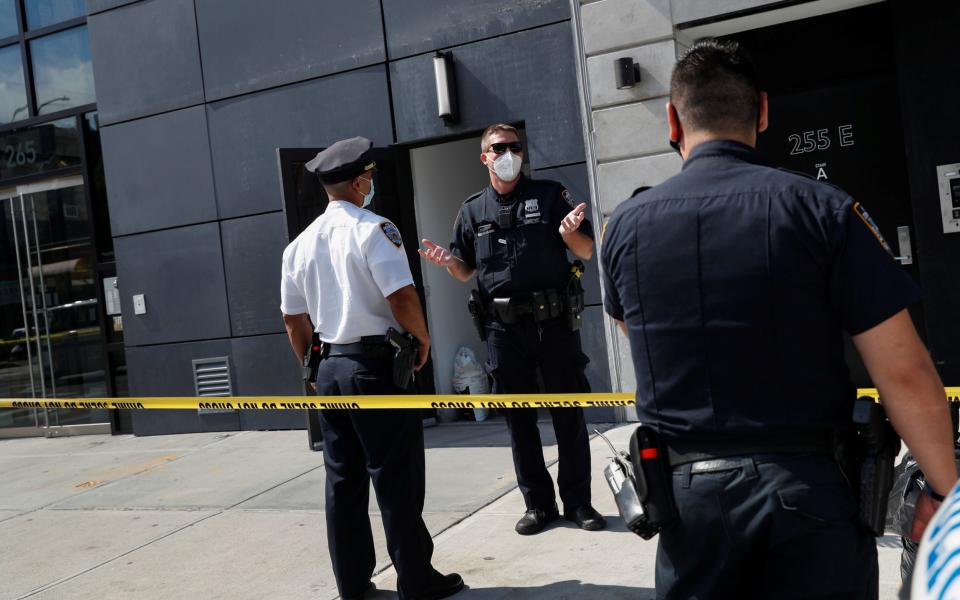 NYPD officers speak at crime scene where Fahim Saleh, co-founder/CEO of Gokada, was found dead at the apartment building in New York City -  SHANNON STAPLETON/Reuters