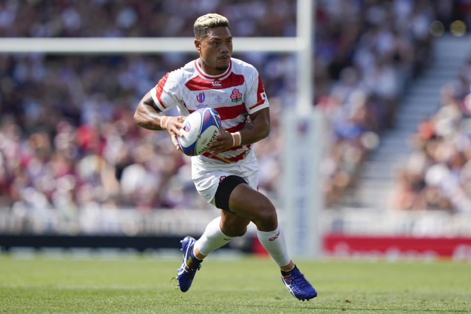 Japan's Lomano Lava Lemeki makes a run during the Rugby World Cup Pool D match between Japan and Chile at Stadium de Toulouse, Toulouse, France, Sunday, Sept. 10, 2023. (AP Photo/Lewis Joly)