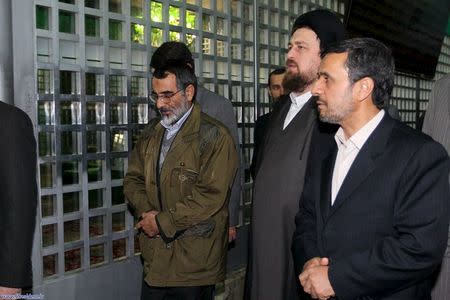 Iran's President Mahmoud Ahmadinejad (R) and the grandson of the late Ayatollah Ruhollah Khomeini, Hassan Khomeini (2nd R), visit his tomb in the Behesht Zahra cemetery, south of Tehran, in a ceremony marking the anniversary of Iran's Islamic Revolution in this February 4, 2012 file photo. REUTERS/President.ir/Handout/Files