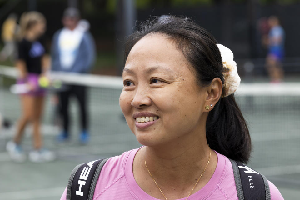 Lan Yao-Gallop talks about her experience in the women’s professional tennis Coach Inclusion Program on a practice court at the Charleston Open tennis tournament in Charleston, S.C., Monday, April 3, 2023. (AP Photo/Mic Smith)