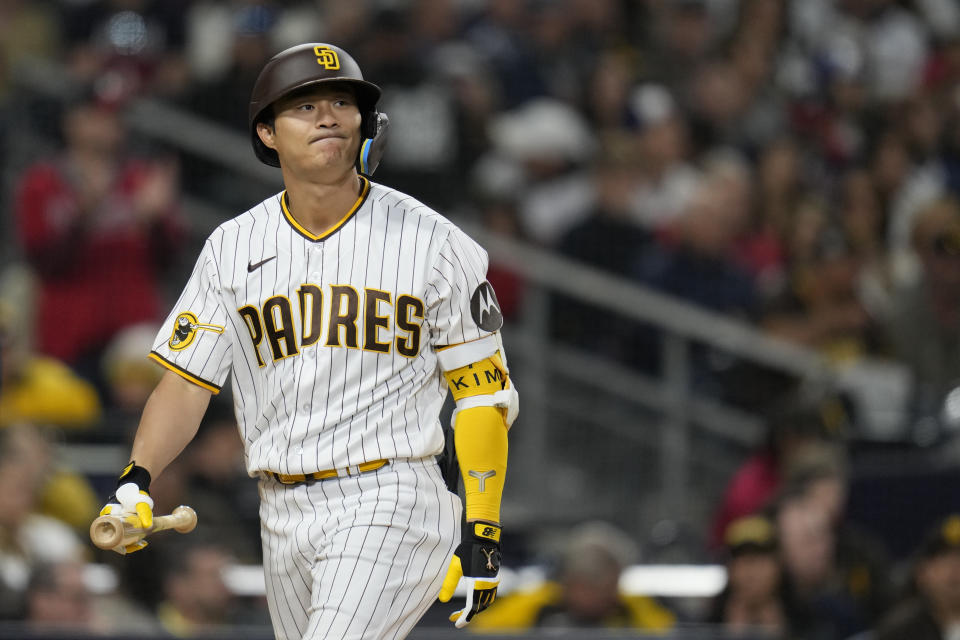 San Diego Padres' Ha-Seong Kim reacts after striking out during the fourth inning of a baseball game against the Atlanta Braves, Tuesday, April 18, 2023, in San Diego. (AP Photo/Gregory Bull)