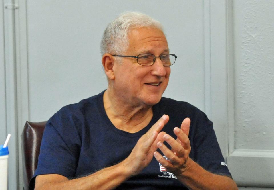 Jim Cardello, of Weymouth, applauds a member's recitation during the Weymouth Elder Services' writers workshop at the Weymouth Senior Center, Wednesday, Dec. 7, 2022.