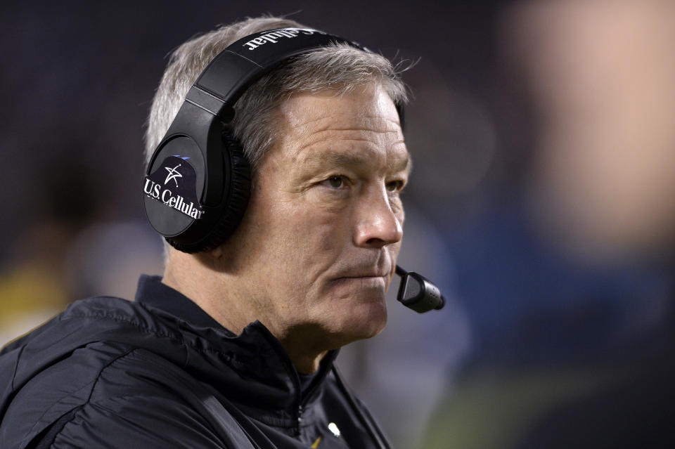 FILE - In this Dec. 27, 2019, file photo, Iowa coach Kirk Ferentz watches from the sideline during the second half of the team's Holiday Bowl NCAA college football game against Southern California in San Diego. Iowa football strength and conditioning coach Chris Doyle has been placed on administrative leave after several black former players posted on social media about what they described as systemic racism in the program. Ferentz made the announcement Saturday, June 6, 2020, calling it "a defining moment” for Iowa's football program in a video posted on the team's Twitter account. (AP Photo/Orlando Ramirez, File)