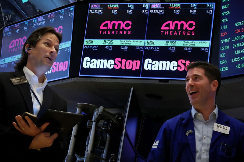 Traders work on the floor of the NYSE in New York