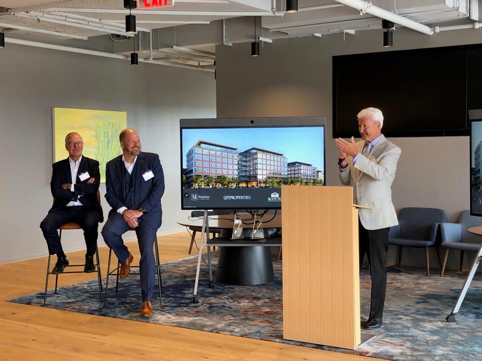 Morristown Mayor Tim Dougherty, right, addresses the crowd as Steve Pozycki, founder and CEO of SJP Properties, left, and Stefan Roehr, global head of supply chain in North America for Sanofi, look on during a groundbreaking event at Morristown's M Station complex on Morris Street Wednesday, June 21, 2023.