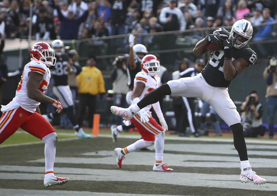 Oakland Raiders tight end Jared Cook (87) catches a touchdown against the Kansas City Chiefs during the second half of an NFL football game in Oakland, Calif., Sunday, Dec. 2, 2018. (AP Photo/Ben Margot)