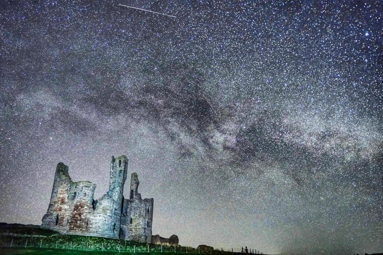 The Milky Way and millions of stars over Dunstanburgh Castle in the early hours of the morning: PA