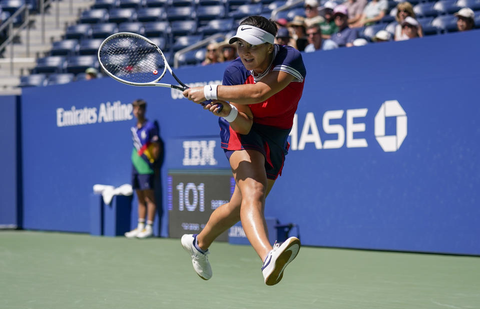 Bianca Andreescu, of Canada, returns a shot to Greet Minnen, of Belgium, during the third round of the US Open tennis championships, Saturday, Sept. 4, 2021, in New York. (AP Photo/Seth Wenig)