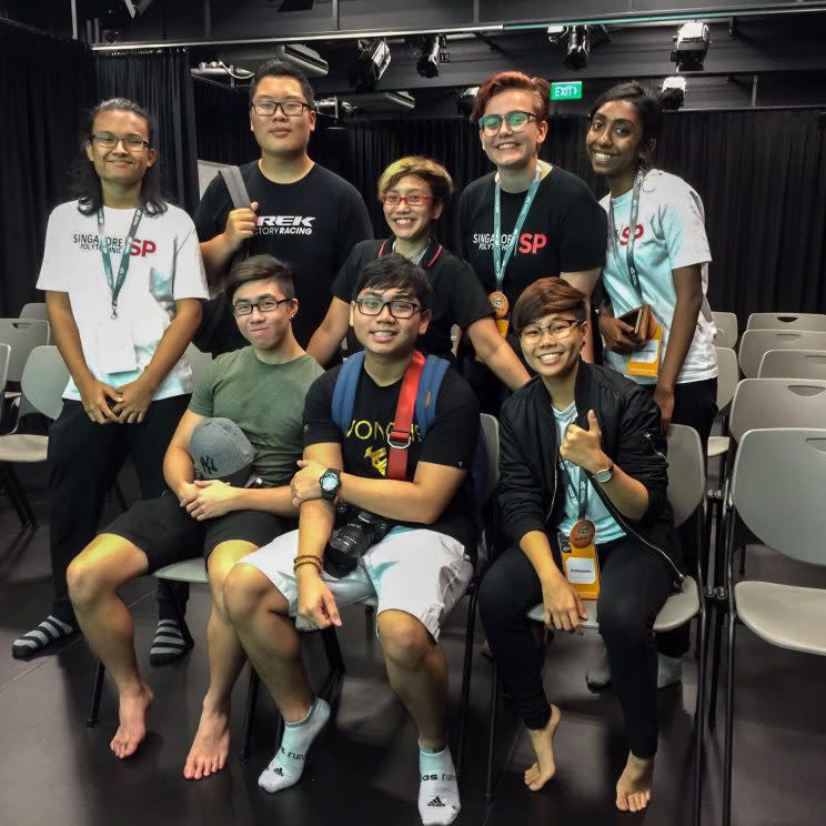 Oniatta Effendi, 43 (blonde hair, red specs) with her youngest stepson Muhammad Zharfan bin Muhammad Nizam, 16, in front of her, surrounded by her students from Singapore Polytechnic and her stepson's friends. They were visiting and asked her for a tour of the school. [Photo: Oniatta Effendi]