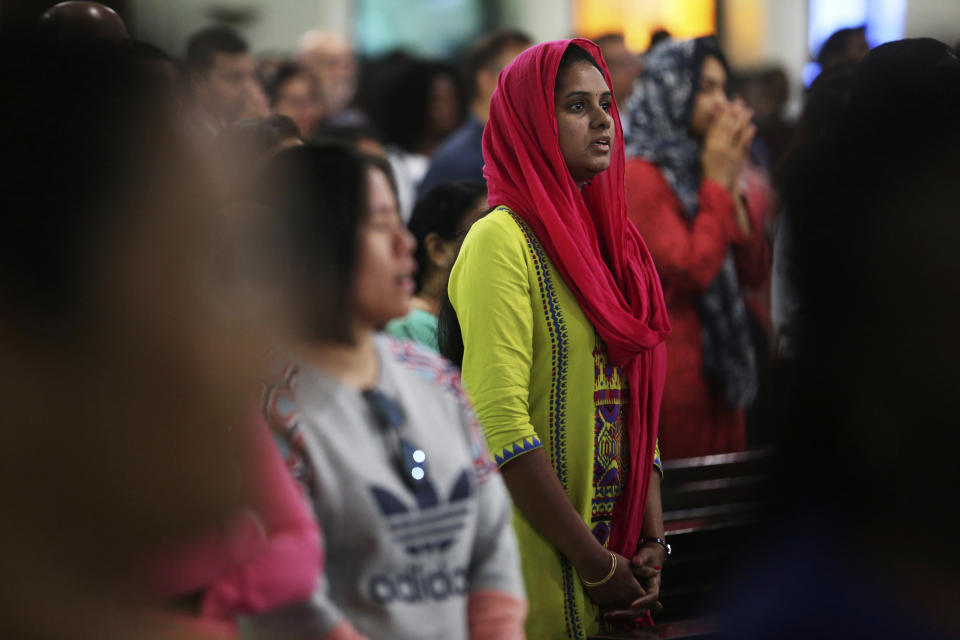 In this Sunday, Jan. 20, 2019 photo, a woman prays during Mass at St. Mary's Catholic Church in Dubai, United Arab Emirates. Pope Francis’ visit to the United Arab Emirates from Feb. 3 through Feb. 5, marks the first ever papal visit to the Arabian Peninsula, the birthplace of Islam. The Catholic Church believes there are some 1 million Catholics in the UAE today. The backbone of that population is Filipino and Indian. (AP Photo/Jon Gambrell)