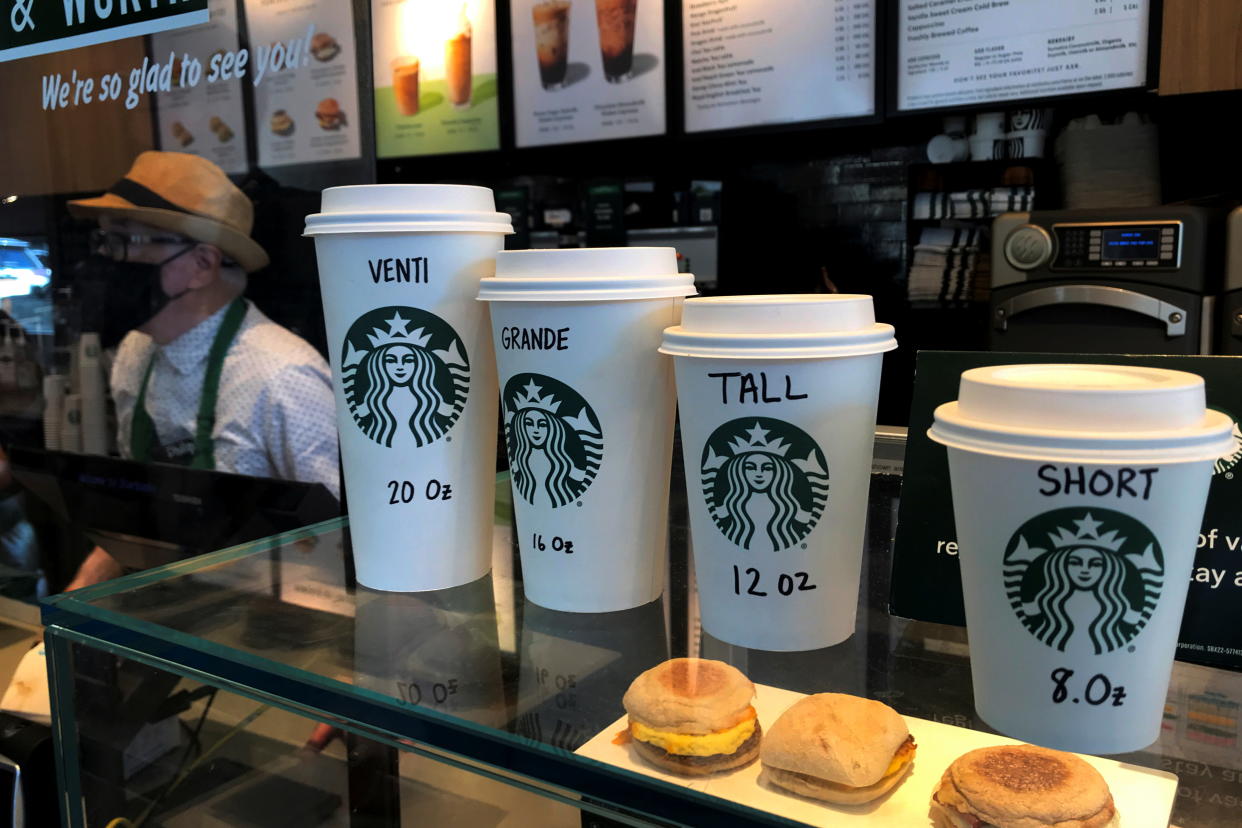 Starbucks cups are pictured on a counter in the Manhattan borough of New York City, New York, U.S., February 16, 2022. REUTERS/Carlo Allegri