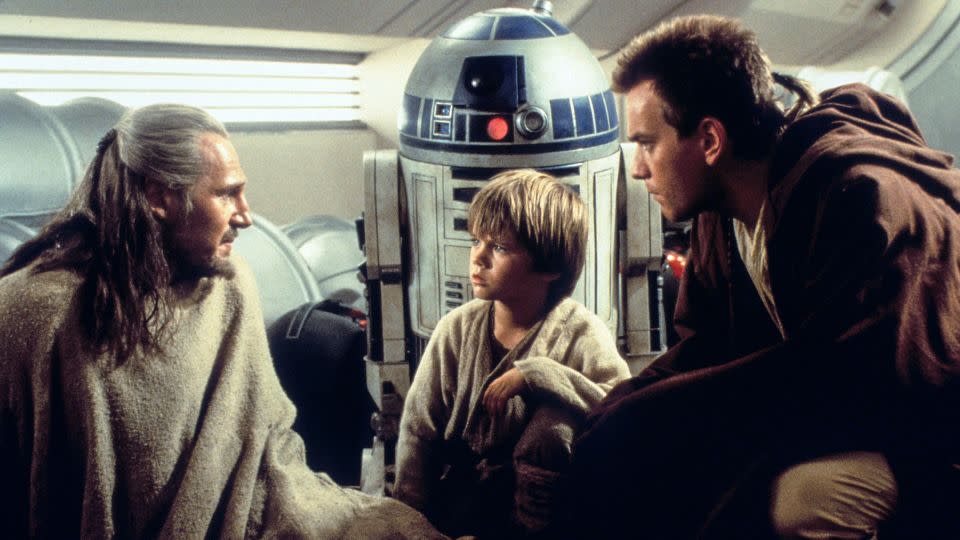 Qui-Gon Jin, R2-D2, Anakin Skywalker and Obi-Wan Kenobi have a fateful meeting in "The Phantom Menace." - Lucasfilm Ltd/Everett Collection