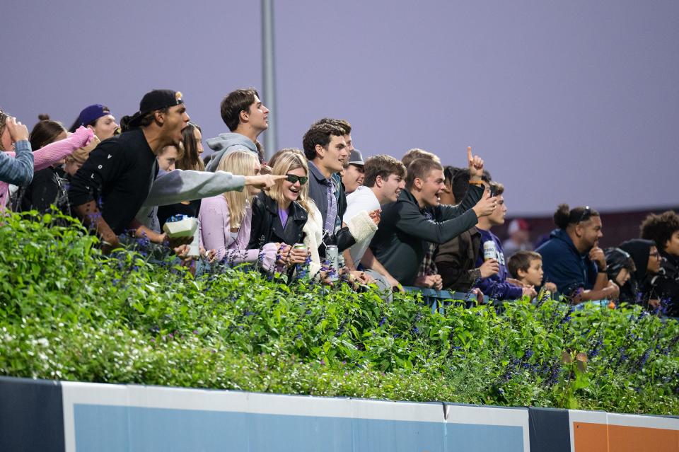 the Holy Cross student section cheers in the EBW Football Classic versus Harvard on Saturday September 30, 2023 at Polar Park in Worcester.