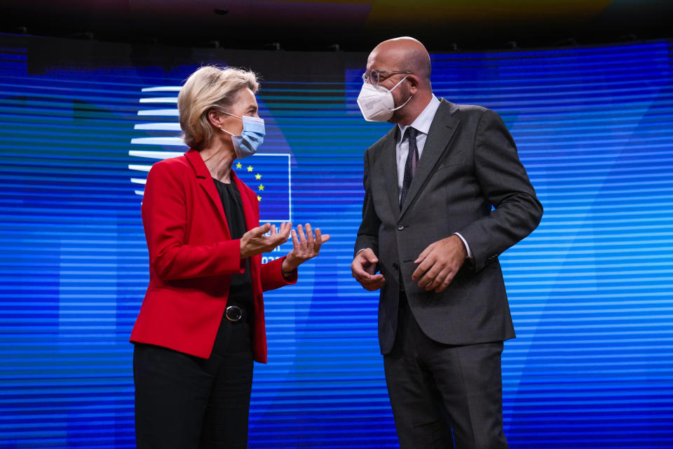 FILE - In this Tuesday, Aug. 24, 2021 file photo, European Commission President Ursula von der Leyen, left, speaks with European Council President Charles Michel at the European Council building in Brussels. The European Union is considering providing a military training mission to Ukraine amid lingering tensions between Russia and the Soviet ex-republic, officials said Monday, Oct. 11, 2021. Acting on a request from Ukraine for help in the "professional military education," the EU has already sent a fact-finding mission to the country last month. The topic will be discussed during a summit scheduled on Tuesday in Kyiv, the officials said on condition of anonymity in accordance with EU practices. (AP Photo/Francisco Seco, File)