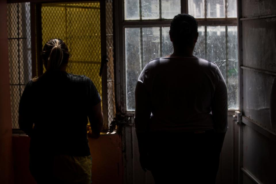 Two central american women who fled their countries due to violence are photographed at a shelter in  Ciudad Juarez on May 5, 2022. 