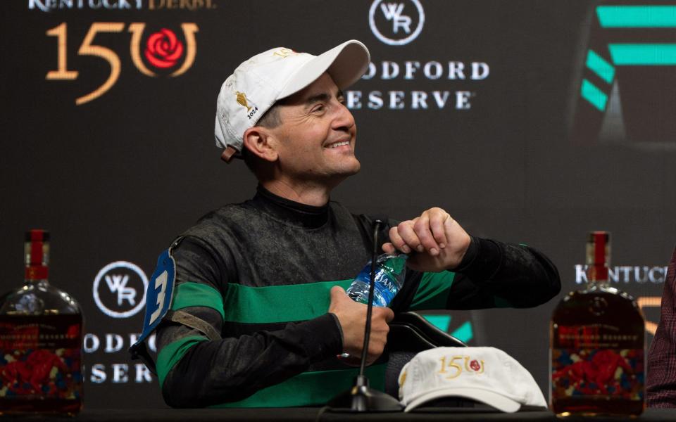 Jockey Brian J. Hernandez Jr smiles after winning the 150th running of the Kentucky Derby at Churchill Downs