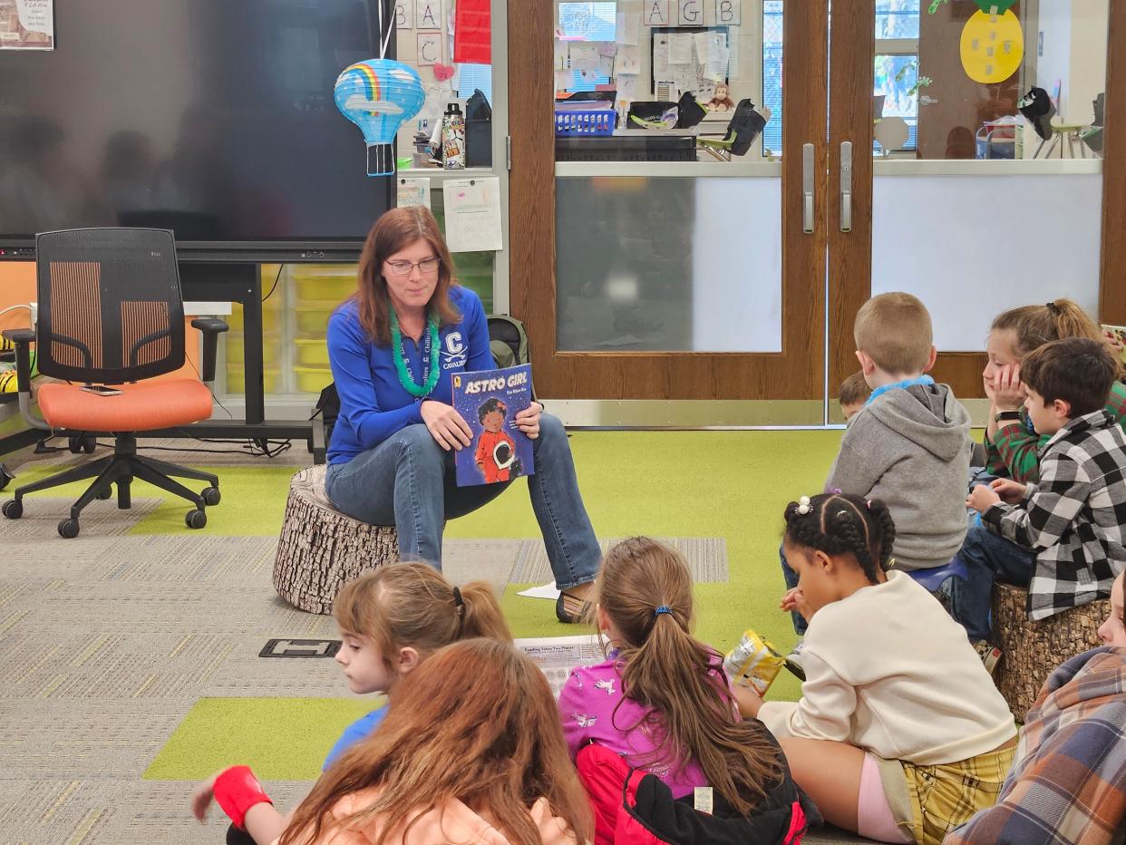 One of the stations during literacy night was a read-along station where faculty read books to students.