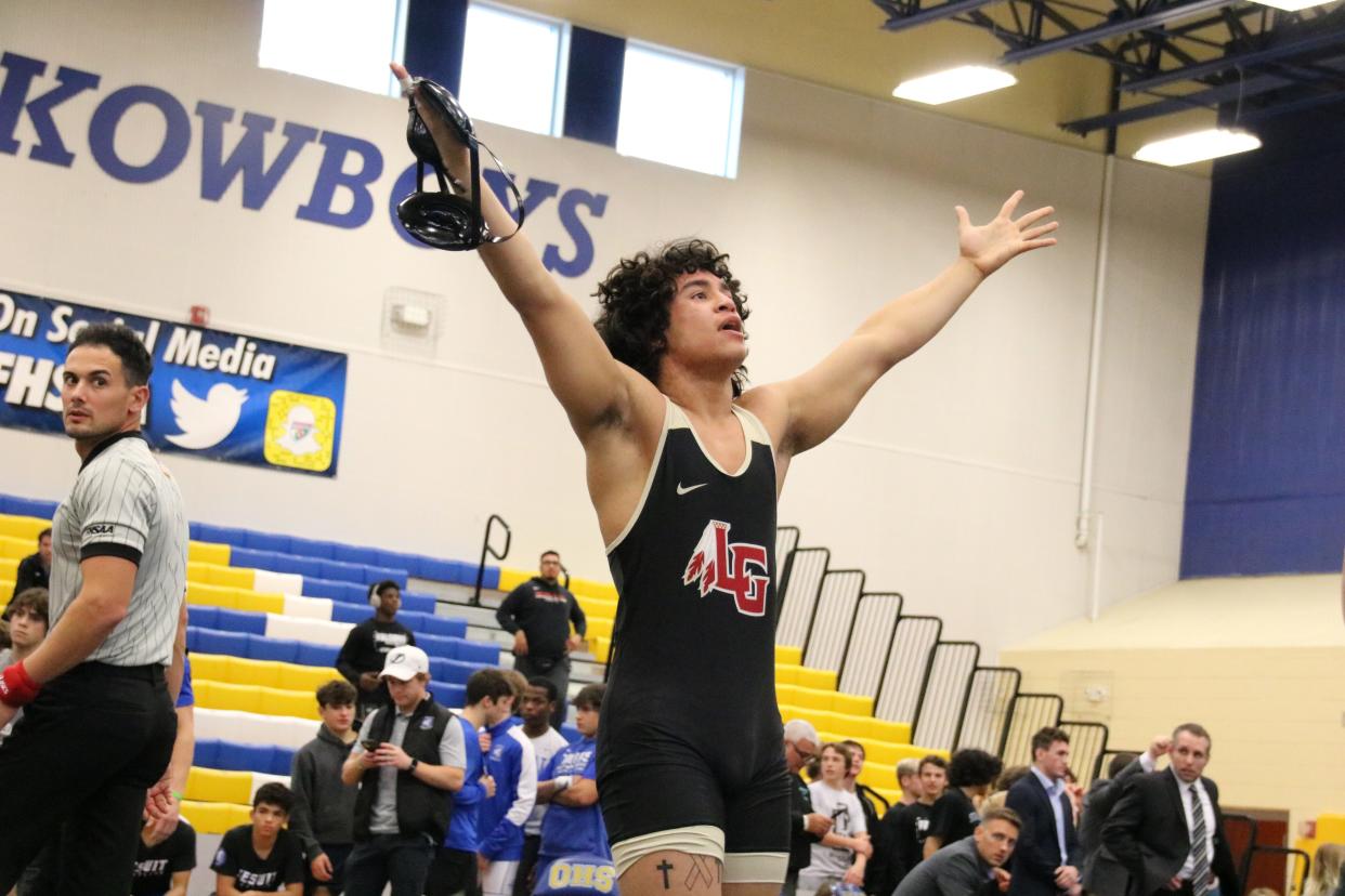 Lake Gibson's Frank Solorzano hypes up the crowd in a Class 2A state dual match on Saturday, Jan. 22, 2022. Jackie Emerson photo.