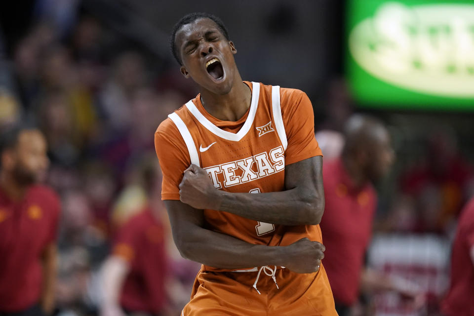Texas guard Andrew Jones (1) celebrates during a timeout during the first half of an NCAA college basketball game against Iowa State, Saturday, Jan. 15, 2022, in Ames, Iowa. (AP Photo/Charlie Neibergall)