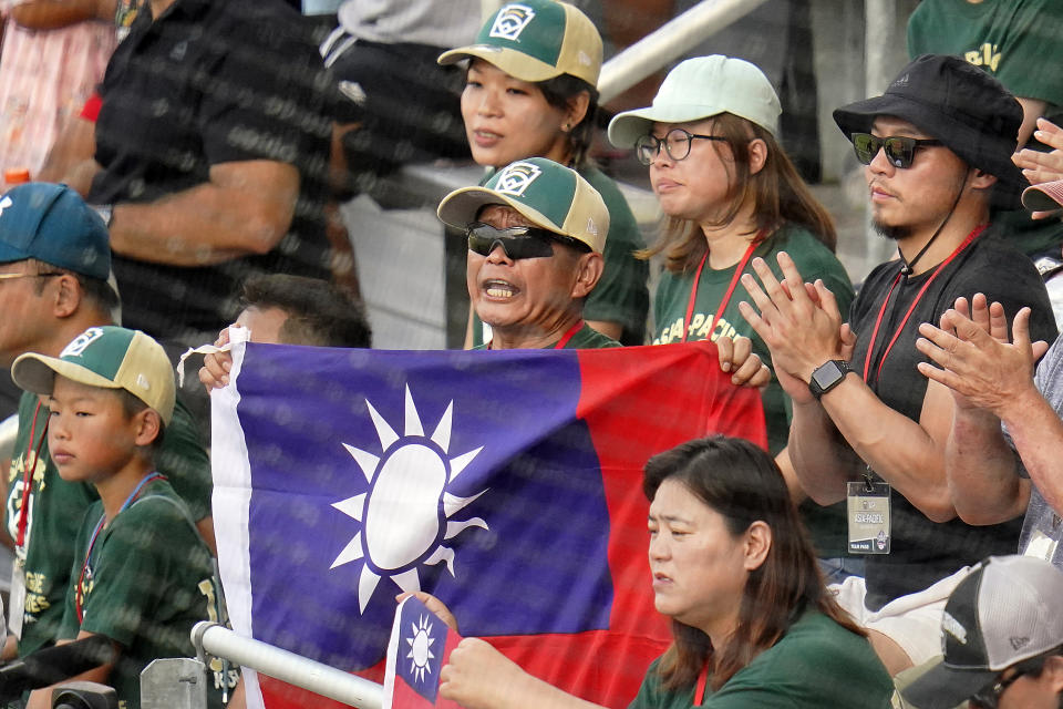 Taiwan fans cheer in the grandstands during the third inning of a baseball game against Japan at the Little League World Series tournament in South Williamsport, Pa., Monday, Aug. 21, 2023. (AP Photo/Tom E. Puskar)