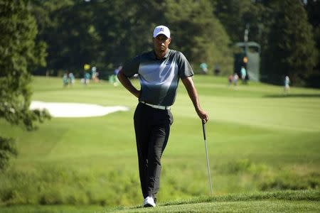 Tiger Woods waits to putt on the 15th hole in the second round of the Quicken Loans National golf tournament at Robert Trent Jones Golf Club. Mandatory Credit: Rafael Suanes-USA TODAY Sports