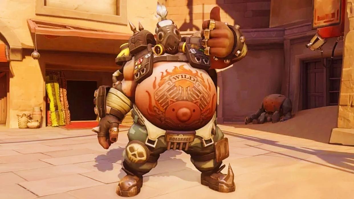  Overwatch's Roadhog puts his thumb up for the camera. 
