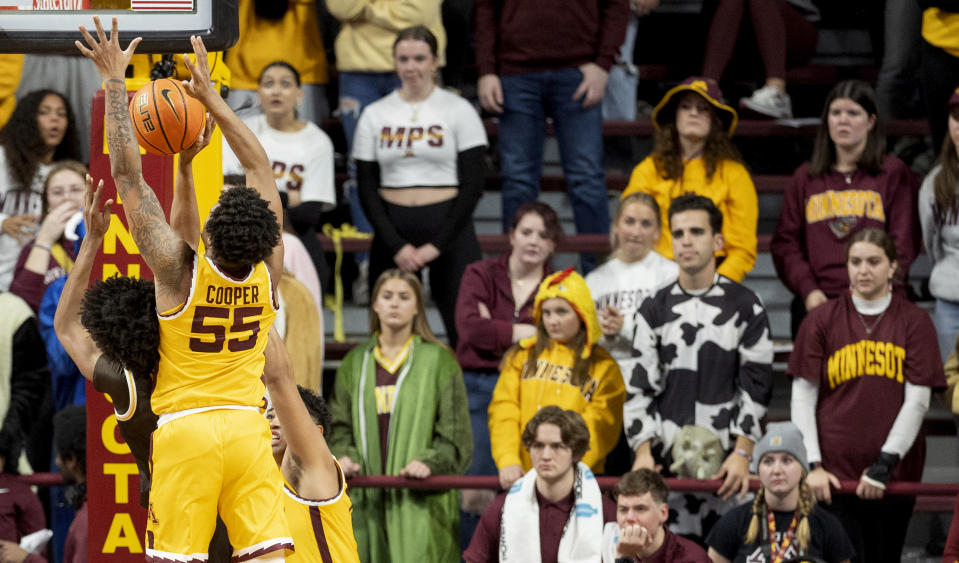 Minnesota's Ta'lon Cooper (55) blocks a Western Michigan shot during the second half of an NCAA college basketball game Monday, Nov. 7, 2022, in Minneapolis. (Carlos Gonzalez/Star Tribune via AP)