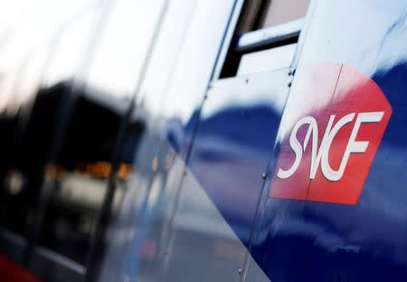 The logo of SNCF is pictured on a train arriving at the French state-owned railway company SNCF station in Bordeaux, France, March 13, 2018. REUTERS/Regis Duvignau