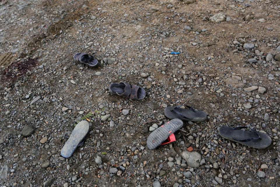<p>Shoes are seen left in a road near Maungdaw, Myanmar, Aug. 30, 2017. (Photo: Soe Zeya Tun/Reuters) </p>