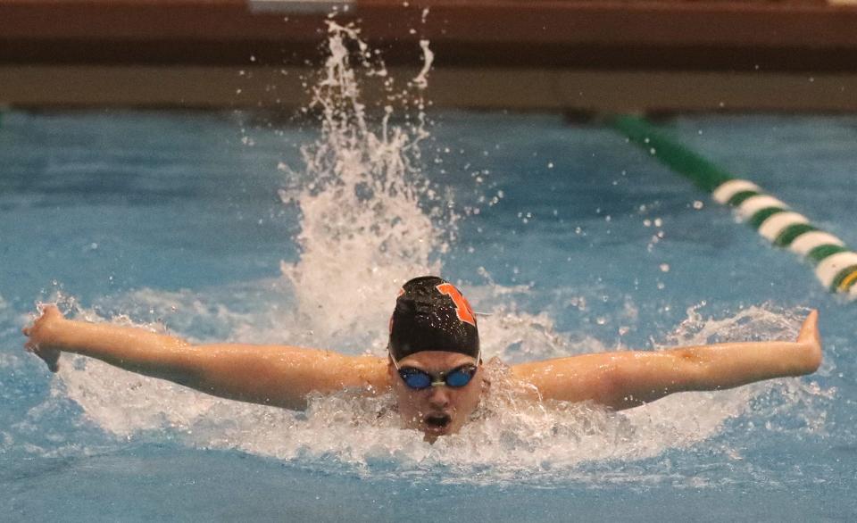 Marlington's Leah Guess swims in the final heat of the girls 100 butterfly in the Division II district meet at Cleveland State, Friday, Feb. 16, 2024.