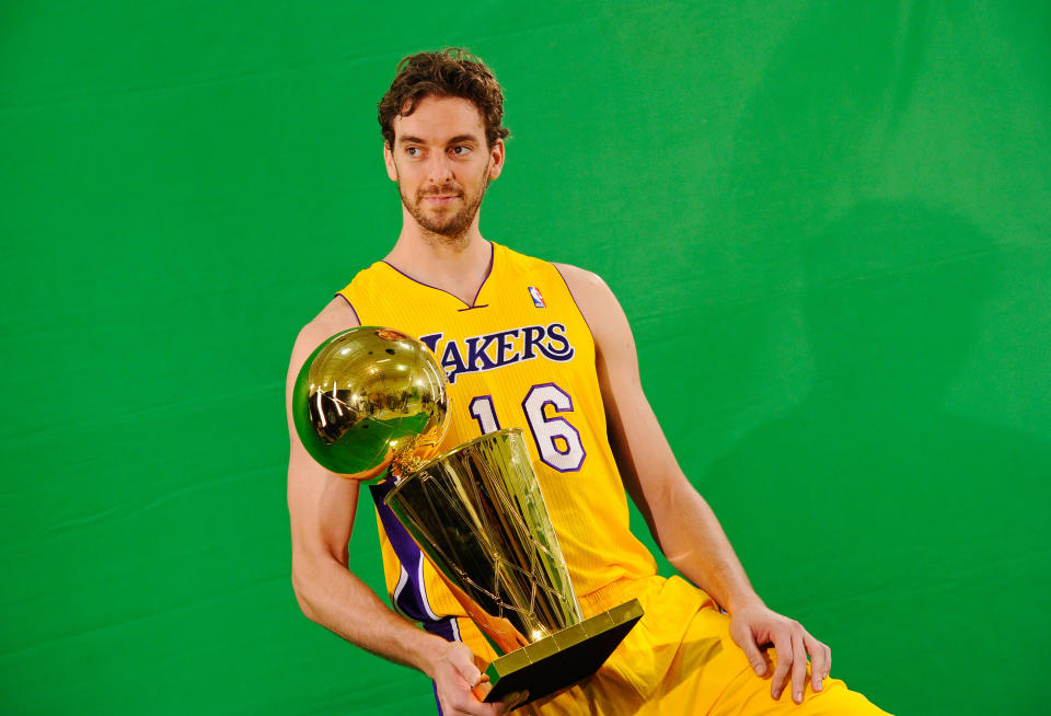 EL SEGUNDO, CA - SEPTEMBER 25:  Pau Gasol #16 of the Los Angeles Lakers poses for a photograph with the NBA Finals Larry O'Brien Championship Trophy during Media Day at the Toyota Center on September 25, 2010 in El Segundo, California. NOTE TO USER: User expressly acknowledges and agrees that, by downloading and/or using this Photograph, user is consenting to the terms and conditions of the Getty Images License Agreement.  (Photo by Kevork Djansezian/Getty Images)