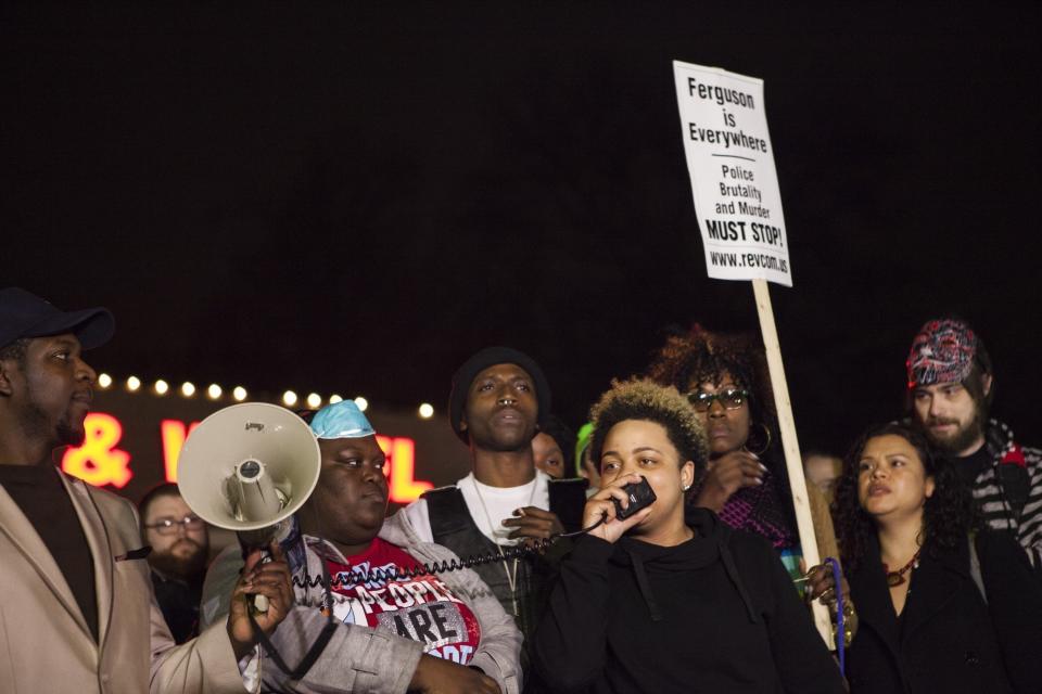 Protestors gather and shout slogans in front of the Ferguson Police Department during ongoing protests after the Justice Department released their report exposing corruption in the police department and court system of Ferguson, USA on March 12, 2015. Officials, including the Chief of Police, have been forced to resign after the release of the report. 