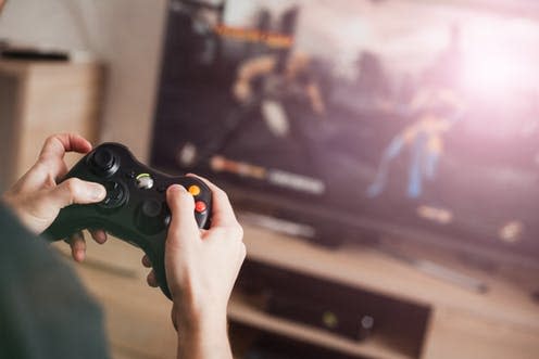 <span class="caption">There is no strong evidence linking violent behaviour with violent video games</span> <span class="attribution"><a class="link " href="https://www.shutterstock.com/image-photo/guy-playing-on-console-663218446" rel="nofollow noopener" target="_blank" data-ylk="slk:korobskyph/Shutterstock;elm:context_link;itc:0;sec:content-canvas">korobskyph/Shutterstock</a></span>