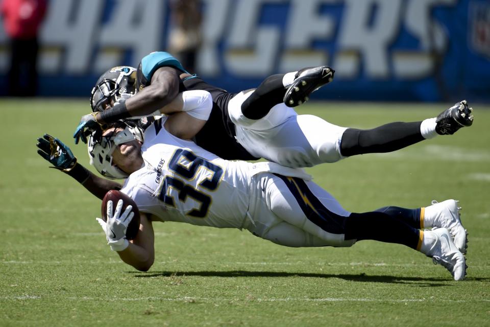 <p>San Diego Chargers running back Danny Woodhead, below, is brought down by Jacksonville Jaguars outside linebacker Telvin Smith (50) during the first half of an NFL football game Sunday, Sept. 18, 2016, in San Diego. (AP Photo/Denis Poroy) </p>