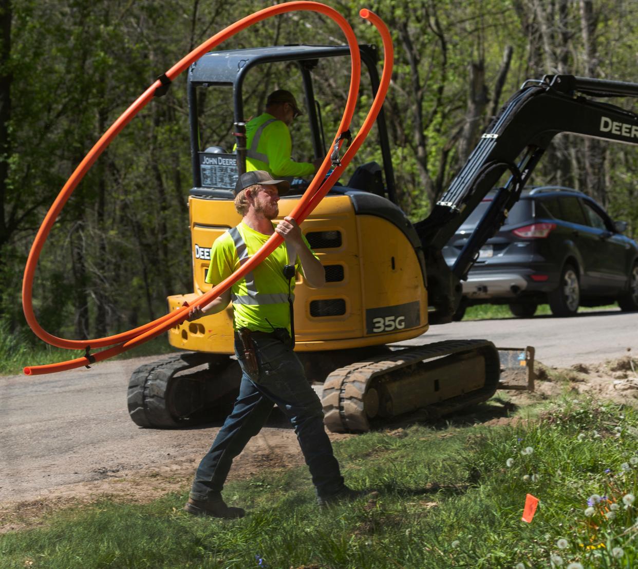 Workers for Eau Claire-based Underground Systems Inc. bury fiber optic cable last spring in Hager City. The project was partially funded by a $444,211 state Public Service Commission grant to Hager Telephone Co. Hundreds of millions of dollars have been poured into getting high-speed internet, also known as broadband, to rural areas.