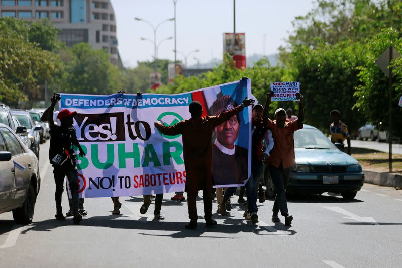 Pro-government supporters are seen during a freedom rally in Abuja