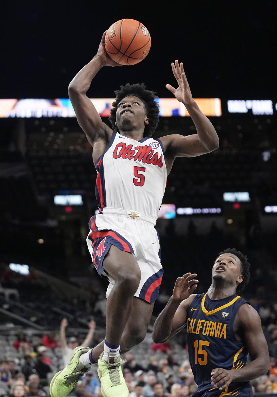 Mississippi guard Jaylen Murray (5) drives to the basket past California guard Jalen Cone (15) during the second half of an NCAA college basketball game in San Antonio, Saturday, Dec. 16, 2023. (AP Photo/Eric Gay)