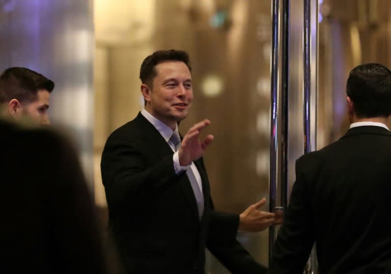 Elon Musk, founder and chief executive of electric carmaker Tesla, seen at a ceremony in Dubai in February, said he would quite President Donald Trump's advisory panels if Washington pulls out of the Paris global climate agreement