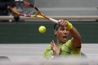 Spain's Rafael Nadal plays a shot against Australia's Jordan Thompson during their first round match at the French Open tennis tournament in Roland Garros stadium in Paris, France, Monday, May 23, 2022. (AP Photo/Christophe Ena)