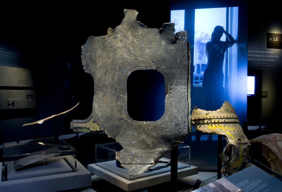 In this May 5, 2014 photo released by the National September 11 Memorial Museum, a piece of airplane damaged in the attacks of September 11, 2001, is displayed at the New York museum. The long-delayed museum will be dedicated during a ceremony Thursday, May 15, 2014. (AP Photo/National September 11 Memorial Museum, Jin Lee)