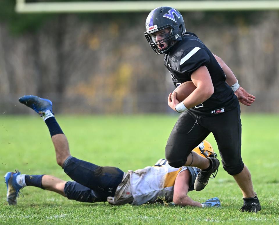 Blackstone Valley Tech's Matthew Gagin gains yardage after making a second-half reception Saturday against Arlington Catholic.