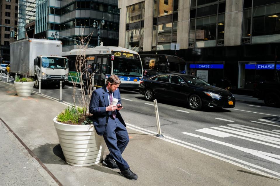 Another cellphone user tries his luck in Manhattan on Tuesday. AFP via Getty Images